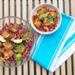 large bowl and small bowl of banh mi salad with dish towel