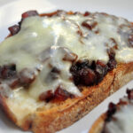 toast with caramelized onion and cheddar melted on top