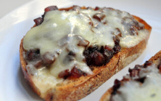 toast with caramelized onion and cheddar melted on top