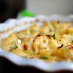cauliflower baked in a cheese sauce served in a pie dish