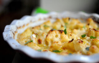 cauliflower baked in a cheese sauce served in a pie dish