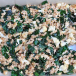 a large pan of farro, cauliflower and kale salad