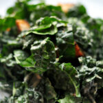 plate of kale caesar salad with croutons