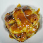 small pile of caramelized bananas on a white background