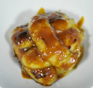 small pile of caramelized bananas on a white background