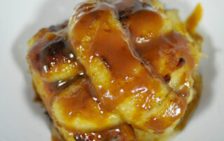 small pile of caramelized bananas on a white background