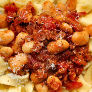 Chorizo and white bean ragu on a bed of fresh pasta