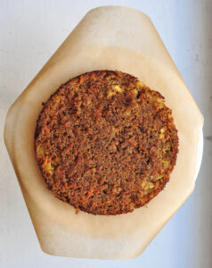 one layer of carrot-pineapple cake on parchment paper