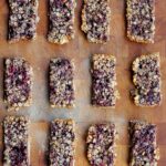 peanut butter and jelly granola bars on laying on a wooden board