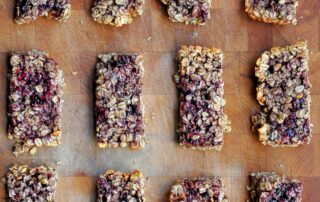 peanut butter and jelly granola bars on laying on a wooden board