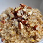 baklava oatmeal in a bowl, topped with chopped almonds